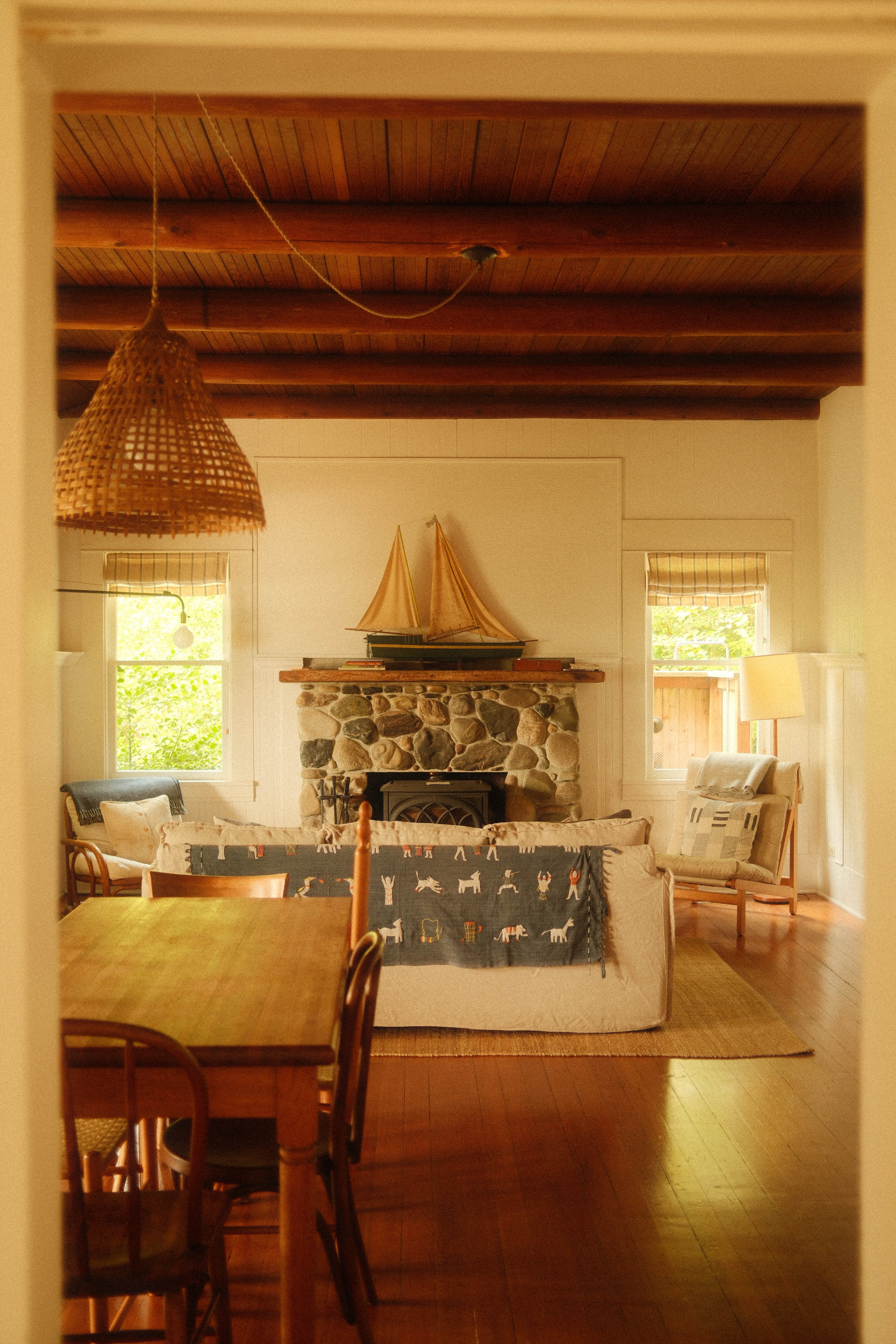 Image of a living room with a stone fireplace